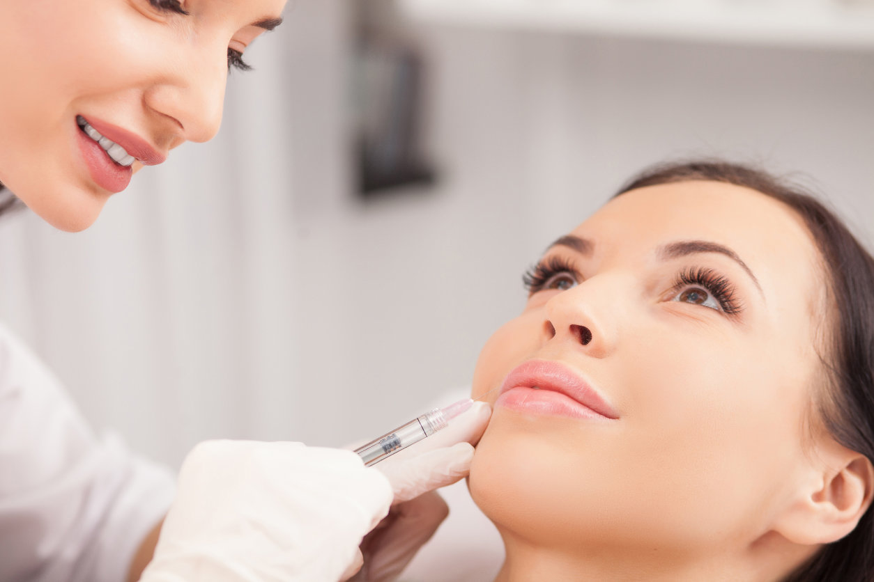 Cheerful,Young,Woman,Is,Getting,Botox,Procedure.,The,Doctor,Is